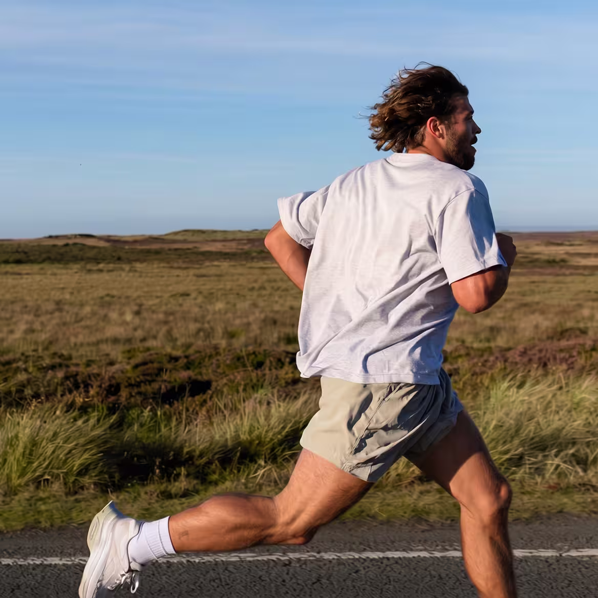 Person running outdoors on a coastal trail